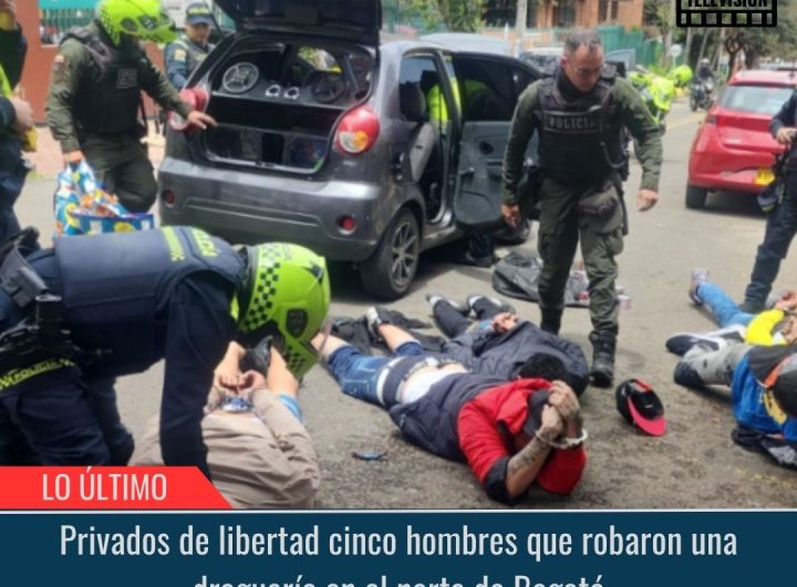 Hombres que robaron una droguería en el norte de Bogotá.